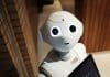 A white robot looks upwards