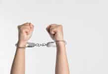 A pair of handcuffed hands