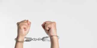 A pair of handcuffed hands