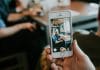 A person videoing themselves on their phone
