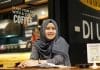 A smiling Muslim student