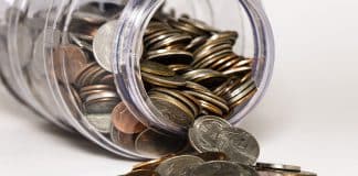 Coins spilling out of a jar