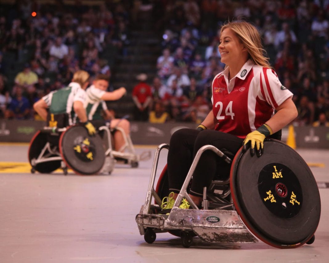 A wheelchair user playing sport