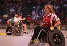 A wheelchair user playing sport