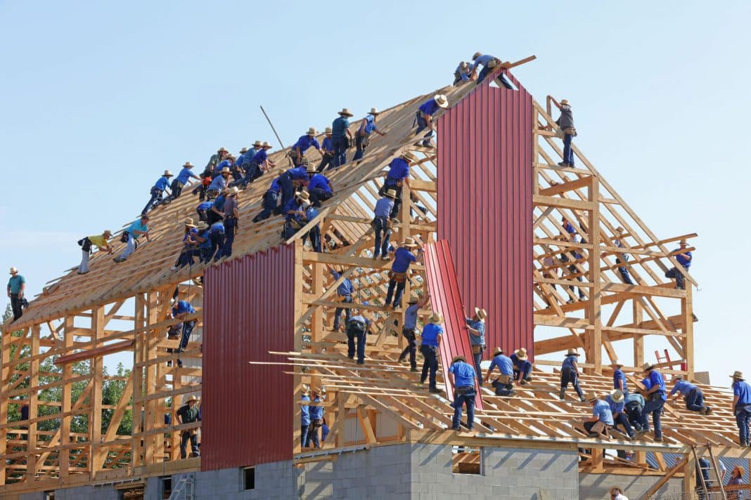 A team putting together a building
