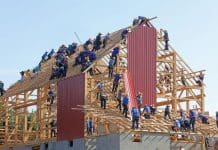 A team putting together a building