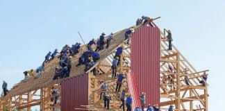 A team putting together a building