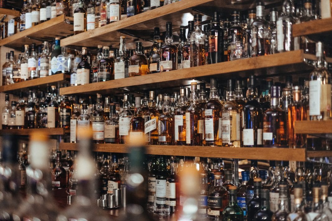 Shelves full of bottles in alcohol shop