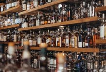 Shelves full of bottles in alcohol shop