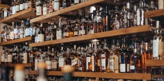 Shelves full of bottles in alcohol shop