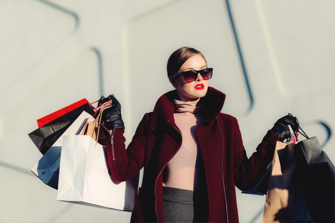 Woman holding lots of shopping bags