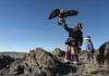 A man holding an eagle in Mongolia