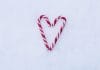 Candy canes in the shape of a love heart