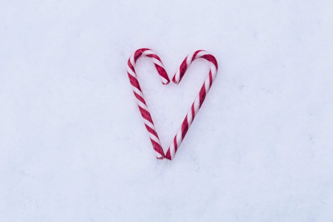 Candy canes in the shape of a love heart