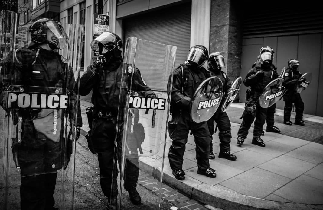 Police holding up shields