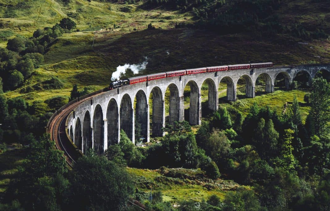 A train travelling across a curved bridge