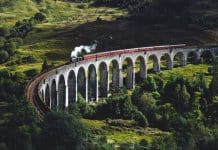 A train travelling across a curved bridge