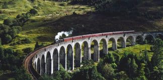 A train travelling across a curved bridge