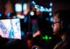 A man with a headset plays e-sports