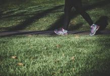 The feet of a person who is walking.
