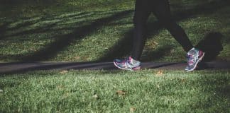 The feet of a person who is walking.