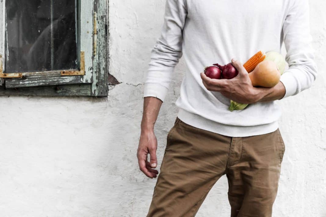 A man holds vegetables
