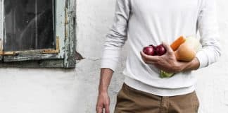 A man holds vegetables