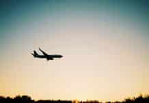A plane flies through the air