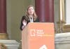 Unite Students' Jenny Shaw stands at a GSL Conference podium