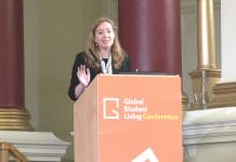 Unite Students' Jenny Shaw stands at a GSL Conference podium