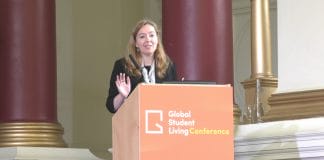 Unite Students' Jenny Shaw stands at a GSL Conference podium