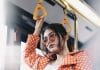 A woman looks disgruntled on a train