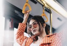 A woman looks disgruntled on a train