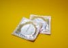 Condoms on a yellow background