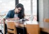 A young woman studies at a table