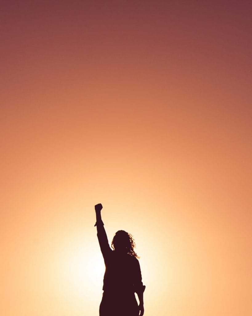 A woman's silhouette punching the air