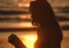 Silhouette of a young woman on a sunny day