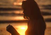 Silhouette of a young woman on a sunny day