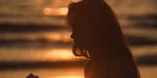 Silhouette of a young woman on a sunny day
