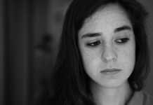 A young woman looking uncertain