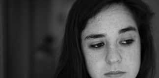 A young woman looking uncertain