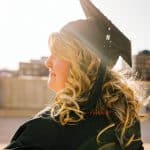 woman wearing academic regalia during daytime