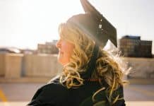 woman wearing academic regalia during daytime