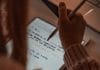 person writing on white paper