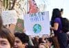 person holding there is no planet b poster