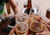 four clear stemless glasses