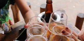 four clear stemless glasses