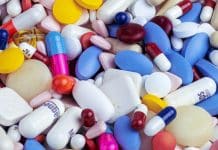 white blue and orange medication pill