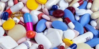 white blue and orange medication pill