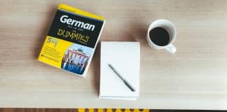 white ceramic mug on white paper